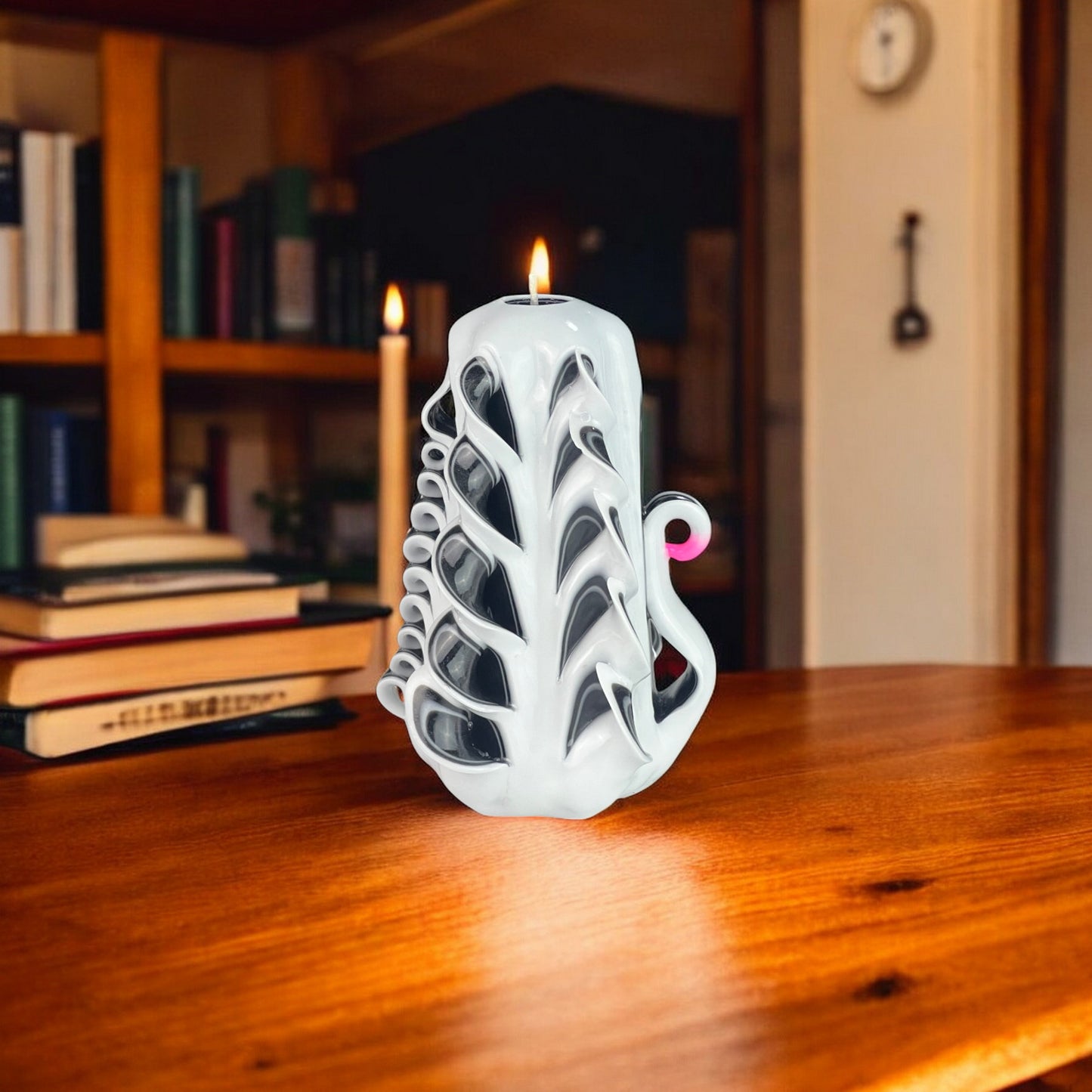 White Swan Candle 350g
A white candle with black accents, designed with a swan-like pattern.