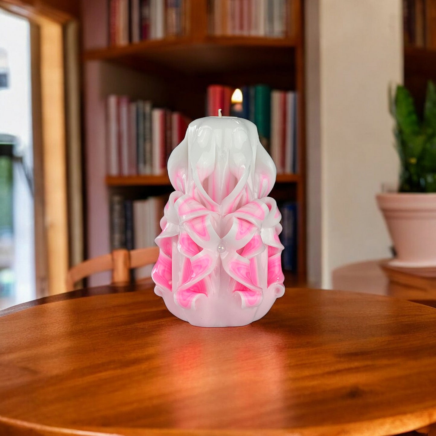 Misty Rose Candle 350g
A pink and white misty rose-shaped candle with a bow on top, set against a white background.