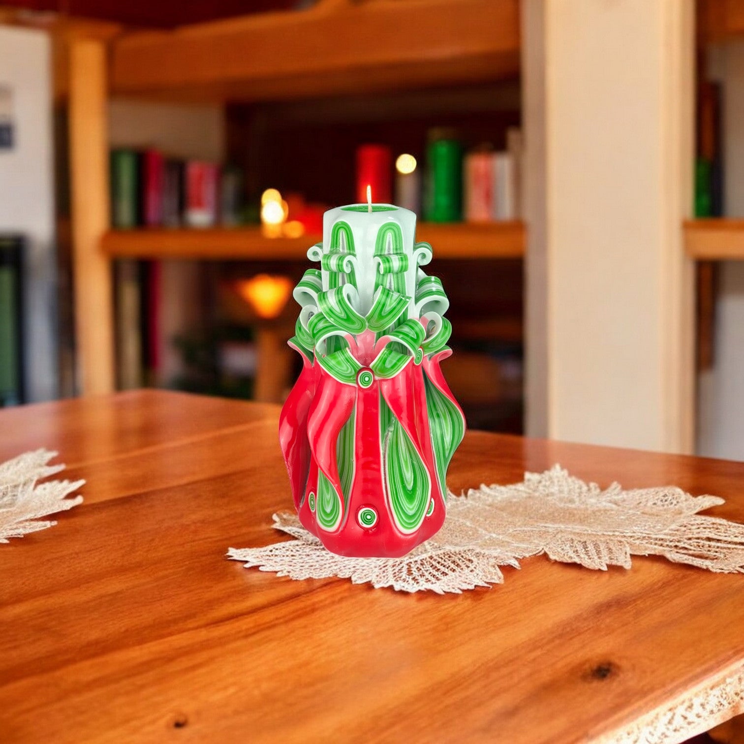 A decorative Christmas-themed candle with red, green, and white colors, featuring a twisted and twirled paraffin design.
Used for Christmas celebrations.