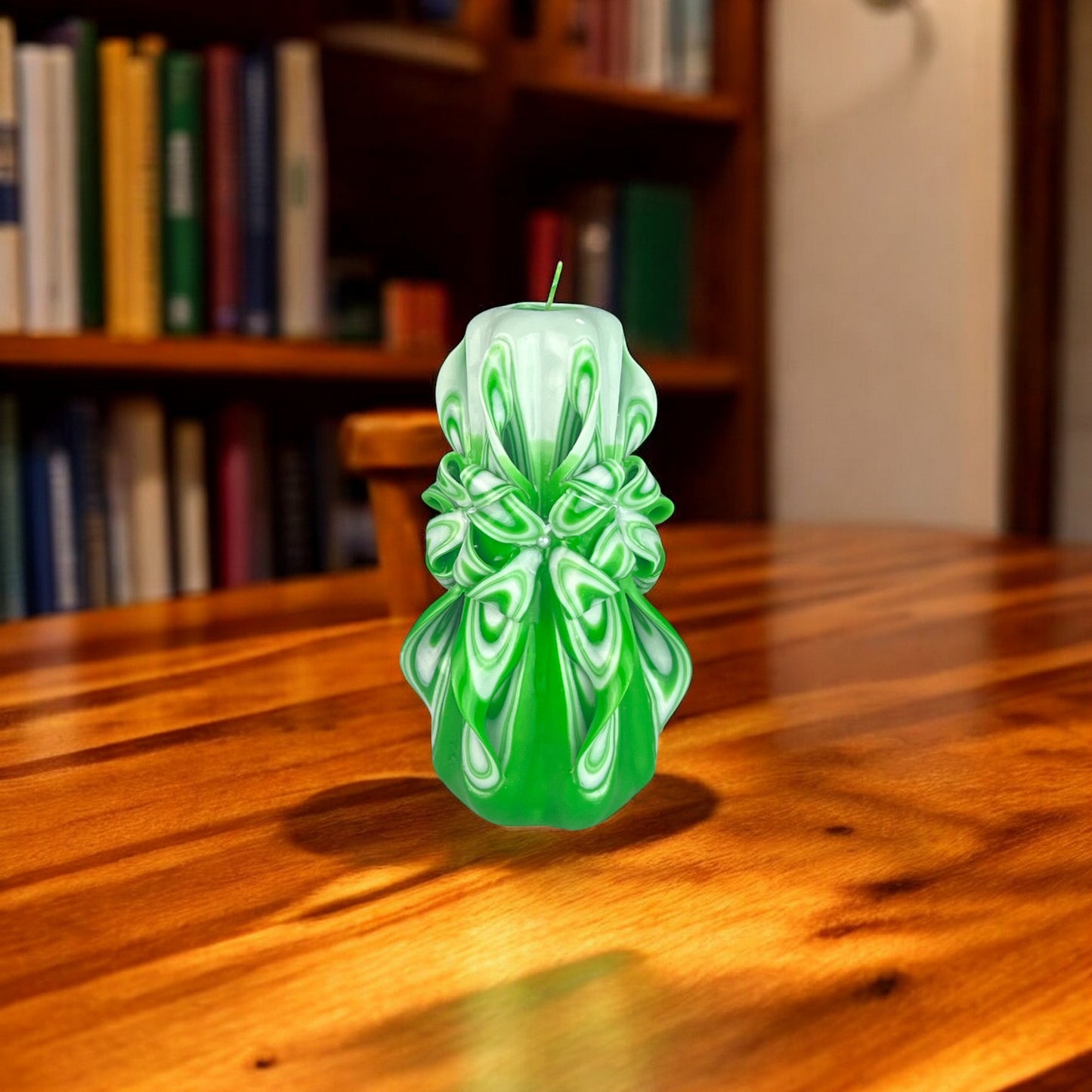 A green candle with a swirling pattern, resembling foliage, on a white background.
A yellow and white candle with a swirling pattern, resembling a sunburst.
Used for romantic dinner, wedding, proposal, baptazing event.