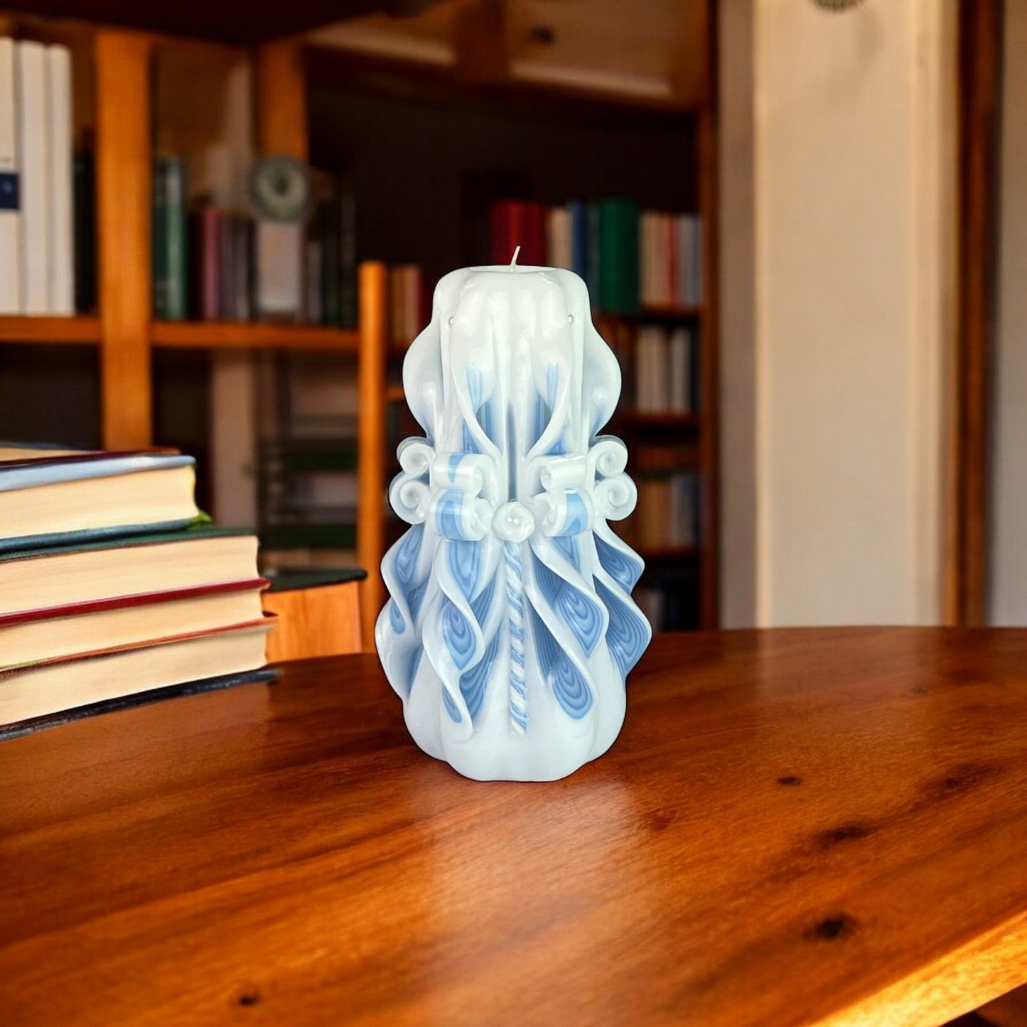 Waterfall Candle 500g
A blue candle with a white and blue floral pattern, resembling a waterfall, on a white background.