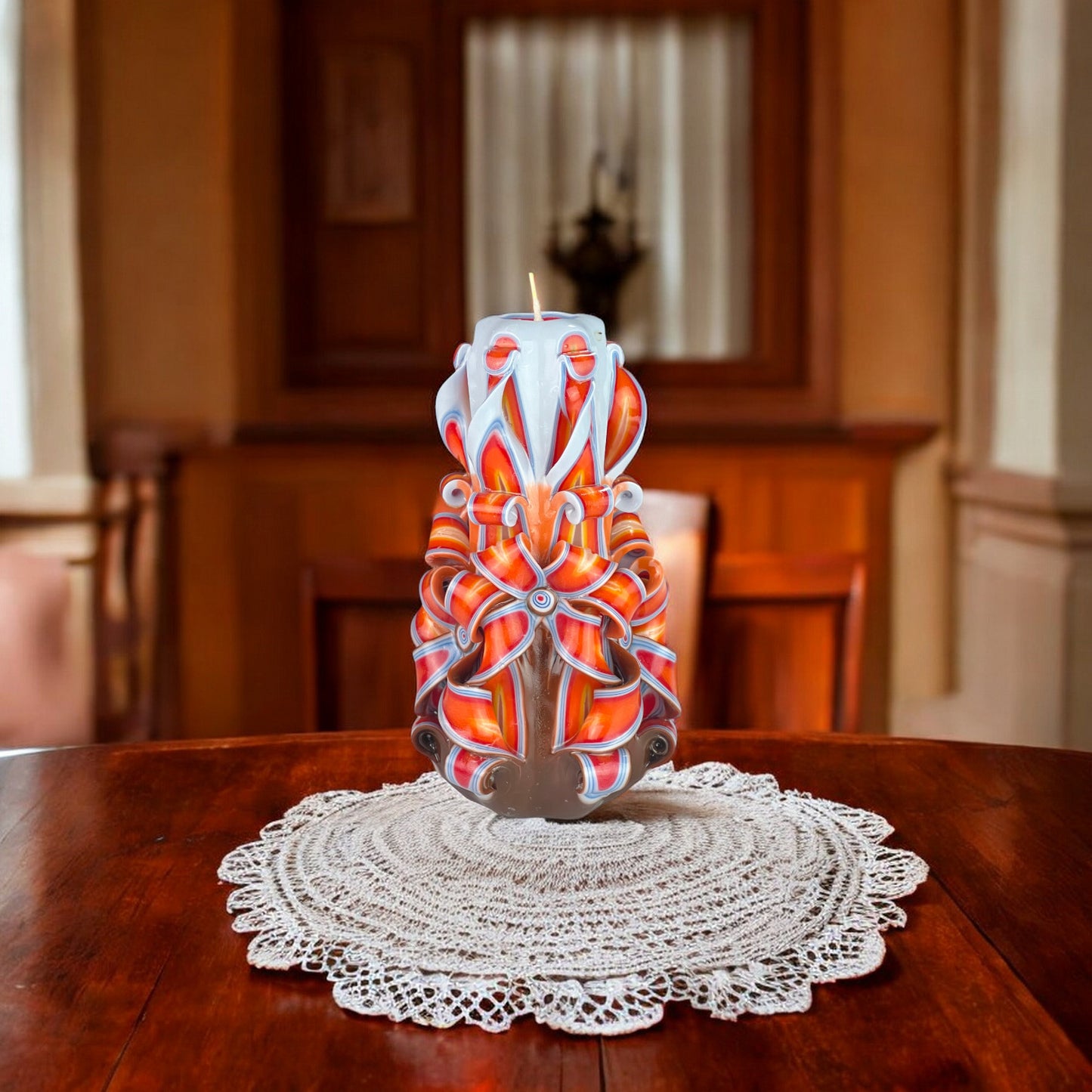 A multicolored carved candle resembling a volcano with orange, red, and brown hues, with a single wick on top.
Used for romantic dinner, wedding, proposal, baptazing event.