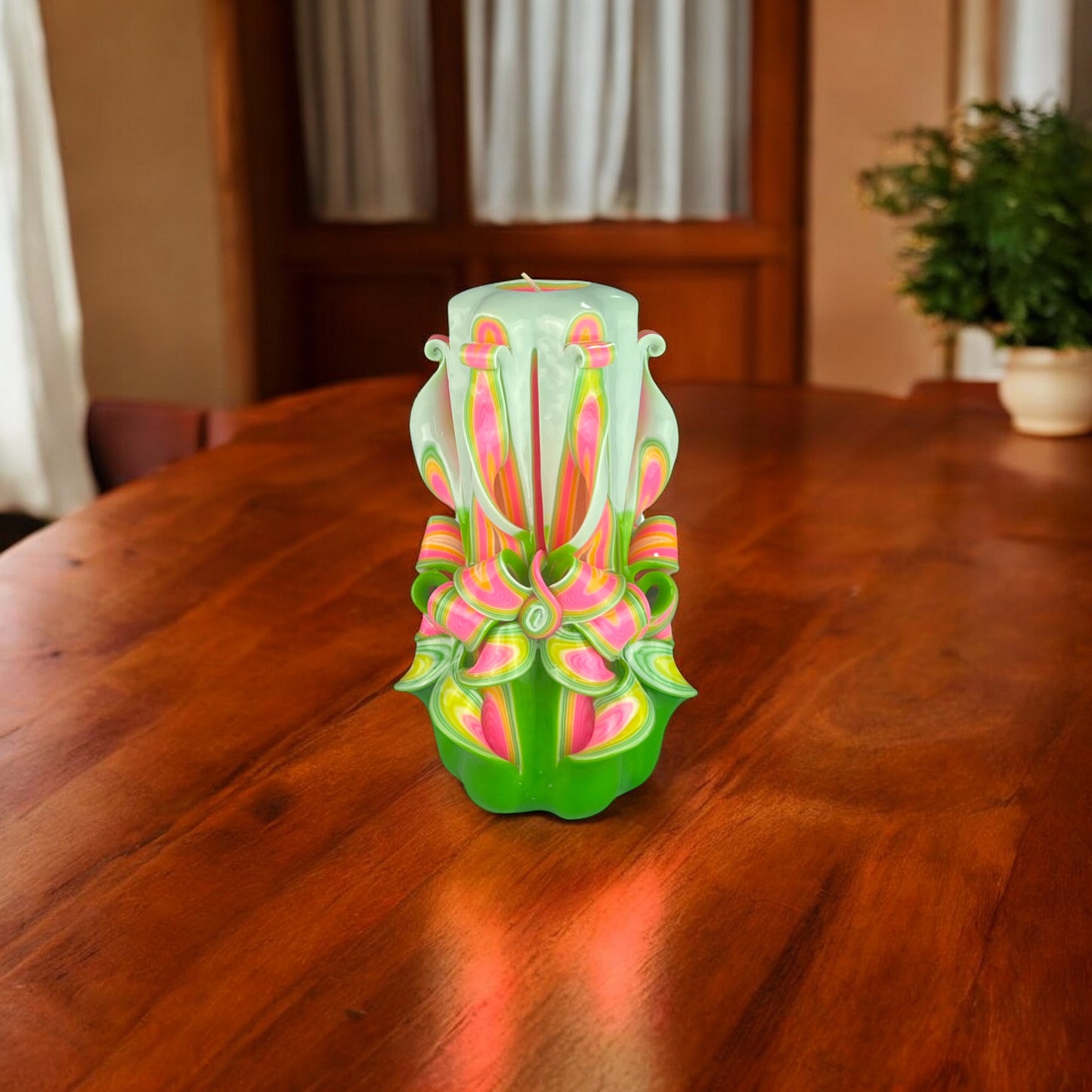 Organic Bloom Candle 950g
A multicolored candle with white, orange, and green tones, featuring an intricate floral design.