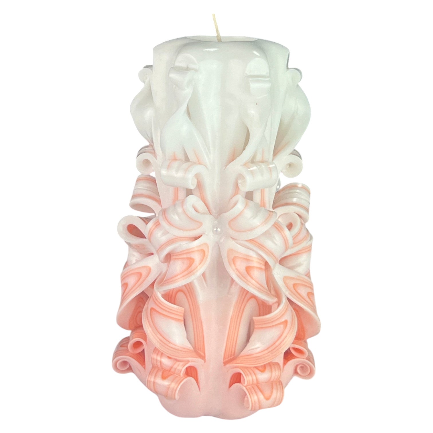 A pale pink, intricately carved candle with a textured surface.
Used for romantic dinner, wedding, proposal, baptazing event.