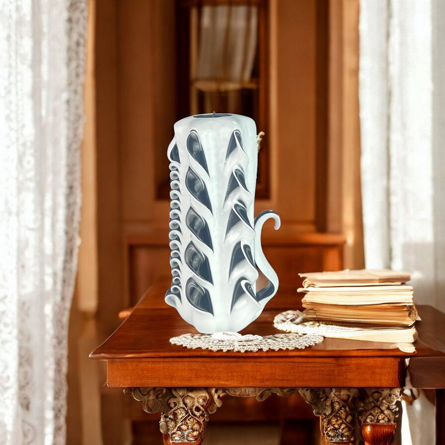 A tall, white candle with black accents, designed with a swan-like pattern on the upper part.
Used for romantic dinner, wedding, proposal, baptazing event.