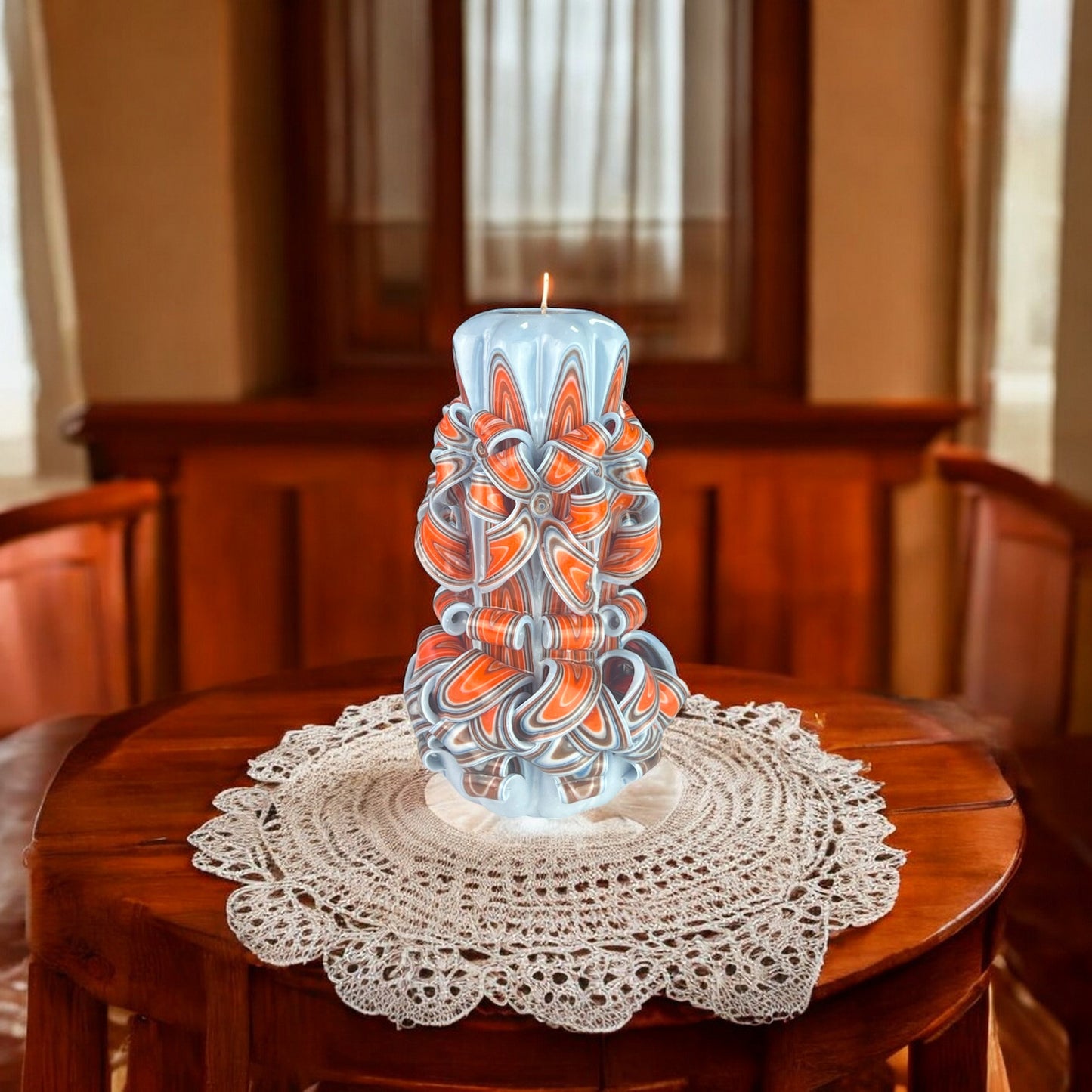 A decorative candle with a gray base and multicolored floral patterns.
Used for romantic dinner, wedding, proposal, baptazing event.